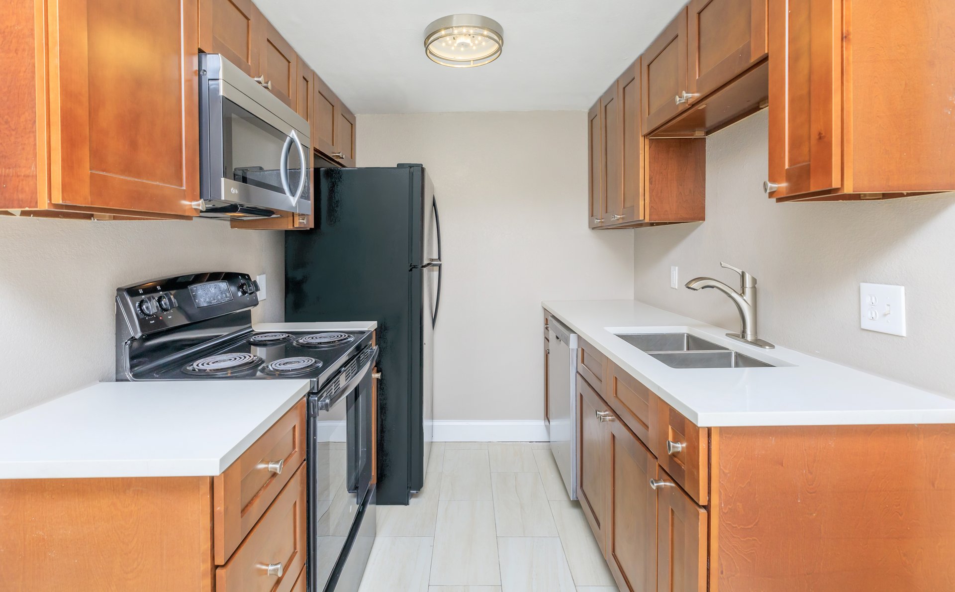 Renovated kitchen with stainless appliances at Manchester House Apartments